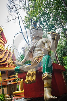 Brahma statue in the public forest temple. Brahma is a creator god in Hinduism and depicted in Hindu iconography with four faces.