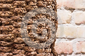 Braid basket with brick wall background interior texture