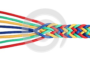 Braided colorful ropes on white, top view. Unity concept photo