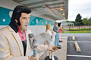 Statues of Elvis Presley, Marilyn Monroe, James Dean, and Betty Boop.