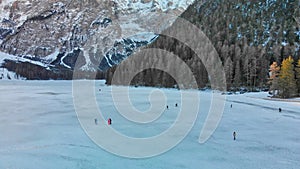 Braies Lake blotted in winter, aerial view from drone, Italian Alps