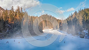 Braies Lake blotted in winter, aerial view from drone, Italian Alps