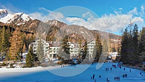 Braies Lake blotted in winter, aerial view from drone, Italian Alps