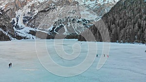 Braies Lake blotted in winter, aerial view from drone, Italian Alps