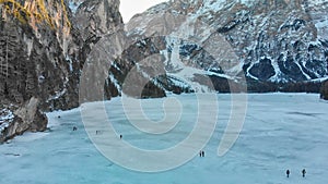 Braies Lake blotted in winter, aerial view from drone, Italian Alps