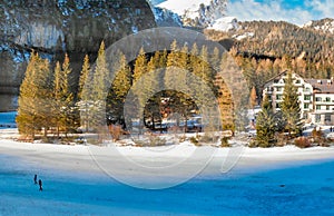 Braies Lake blotted in winter, aerial view from drone, Italian Alps