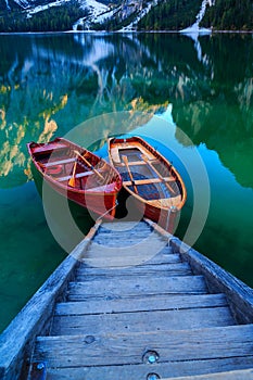 Braies lake and boats in the background of Seekofel mountain