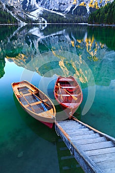 Braies lake and boats in the background of Seekofel mountain