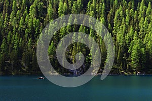 BRAIES LAKE, DOLOMITES, ITALY, 28 MAY, 2023: Tourists at Lago di Braies in the Dolomites, northern Italy, Europe