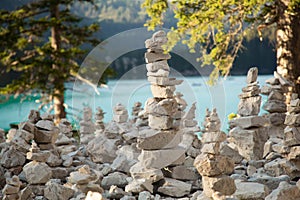 Braies lake: rock and stone man along path around the mountain lake - Dolomites photo