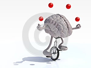 Brain with arms and legs juggle rides a unicycle photo