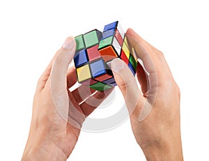 Brain game rubik cube in hand isolated on white background