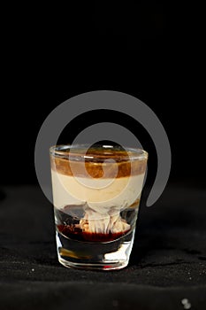 Brain Hemorrhage shot cocktail with schnapps, baileys irish cream and grenadine