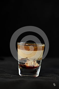 Brain Hemorrhage shot cocktail with schnapps, baileys irish cream and grenadine