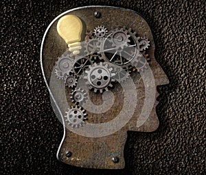 Brain mechanism made from metal cogs and gear with idea bulb