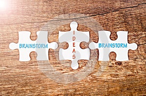 Brainstorm and ideas words on jigsaw puzzle.