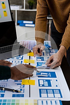 Brainstorm mobile app interface layout design ideas on graphic designer table.ux graphic designer