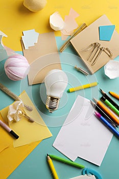 Brainstorming concept with a light bulb and school supplies AI generated