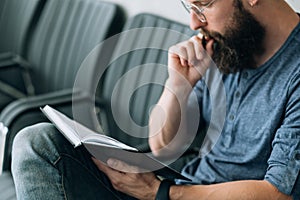 Brainwork thinking focused man read data notepad