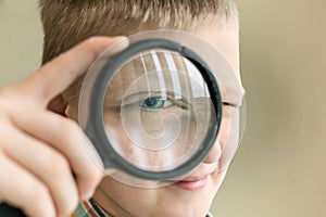 Brainy boy with magnifying glass