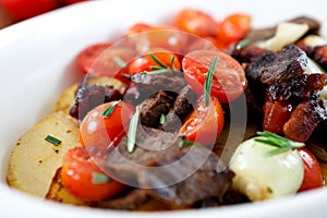 Braised beef with onions,cherry tomatoes and potat