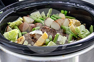 Braised beef pot roast stew with vegetables on table