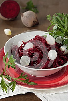Braised beets with small pickled onions and parsley