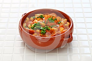 Braised with chorizo and white kidney beans, spanish tapas food photo