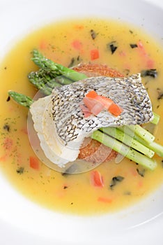 Braised cod fish on top of Asparagus