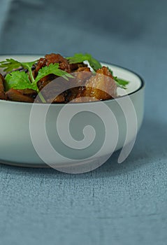 Braised pork and coriander leaves in vertical composition