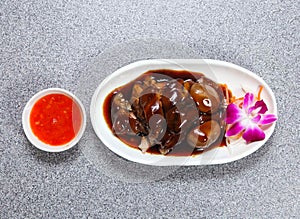 Braised Pork Trotter in thai style with sauce served in dish isolated on grey background top view of hong kong food