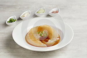 Braised Premium Shark Fin Soup served in a dish isolated on grey background