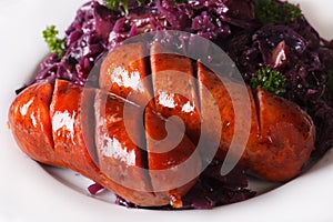 Braised red cabbage and grilled sausages closeup. horizontal