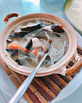 Braised Sea Cucumber in brown soup.