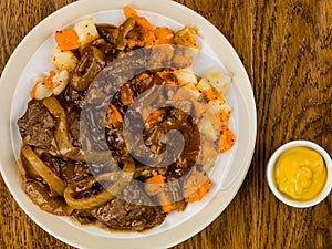 Braised Steak And Root Vegetables With Onion Gravy