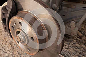 Brake disc, caliper and ball joint of a car.