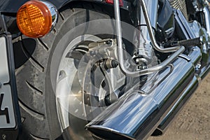 Brake disc and caliper on the rear wheel of the motorcycle.