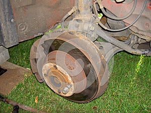 Brake disc old and brake caliper in detailed view from side