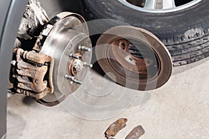 Brake disc. Replacement of the old to the new. Auto mechanic repairing .