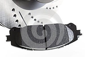 Brake discs and pads on a white background