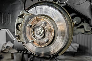 Brake pad on a car disc close-up