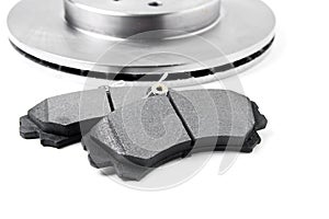 Brake pads and brake discs on white background. Auto parts