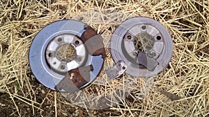 Brake rotors discs with pads. Some worn beyond normal tear and wear.