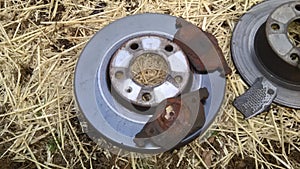 Brake rotors discs with pads. Some worn beyond normal tear and wear.