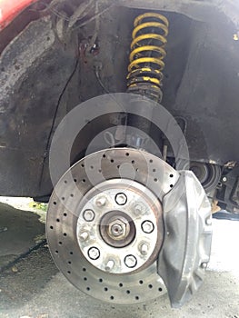 Brake system with shock absorber and suspension.