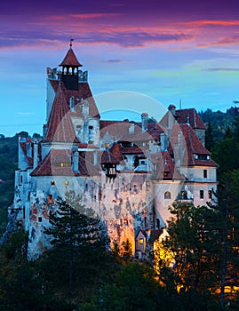 Bran Castle on cliff top on twilight