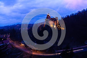 Bran Castle with lights at night in Romania