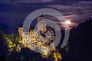 Bran castle at night and full moon