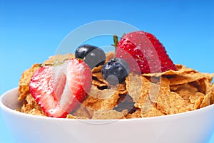 Bran cereal with blueberries, strawberries