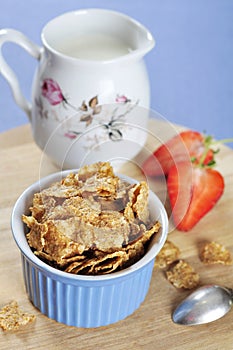 Bran flakes cereal in blue bowl